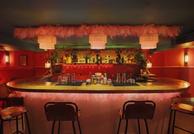 London bar Doña uses pink hues and mixed textures to create a bold interior