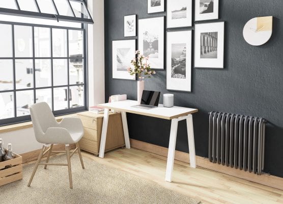 Home office with white table and feature wall