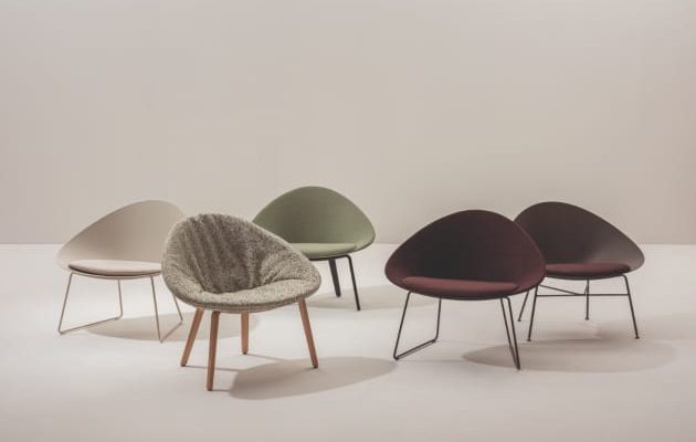 five modern chairs in various colours