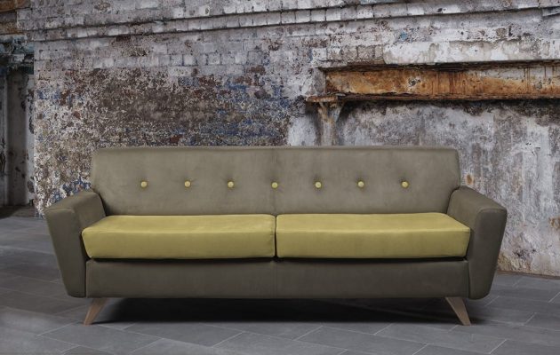 olive green sofa with contrasting cushions in industrial settingatrium of large office building with seating