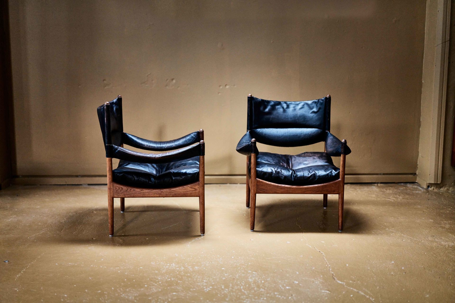 Two black and timber chairs