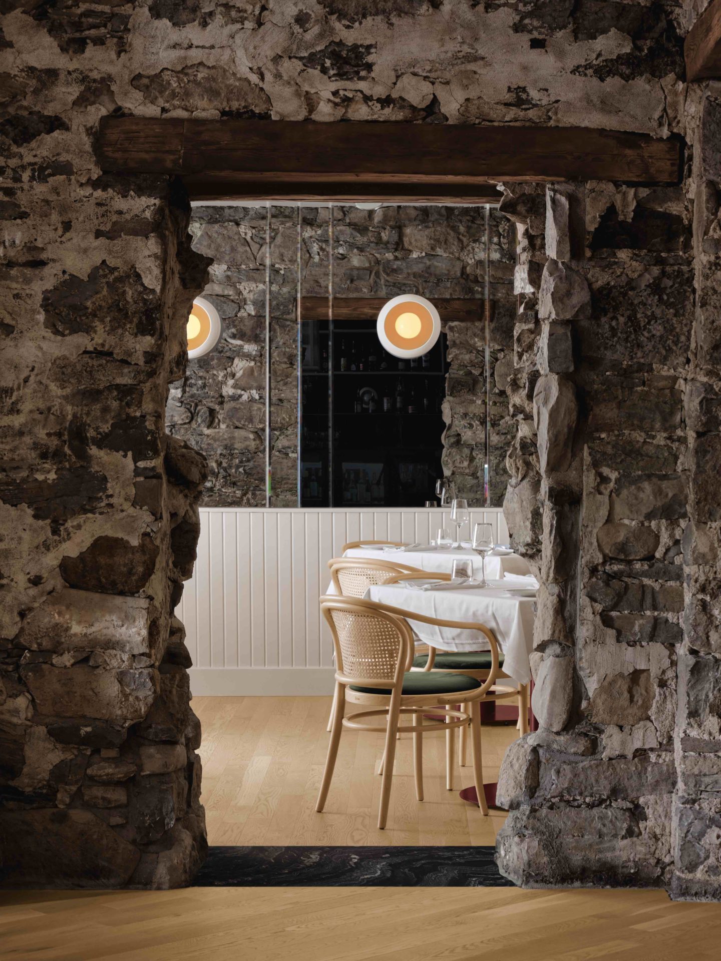 Dining area with original stone wall
