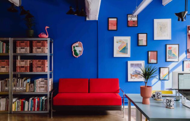 Red sofa against blue wall