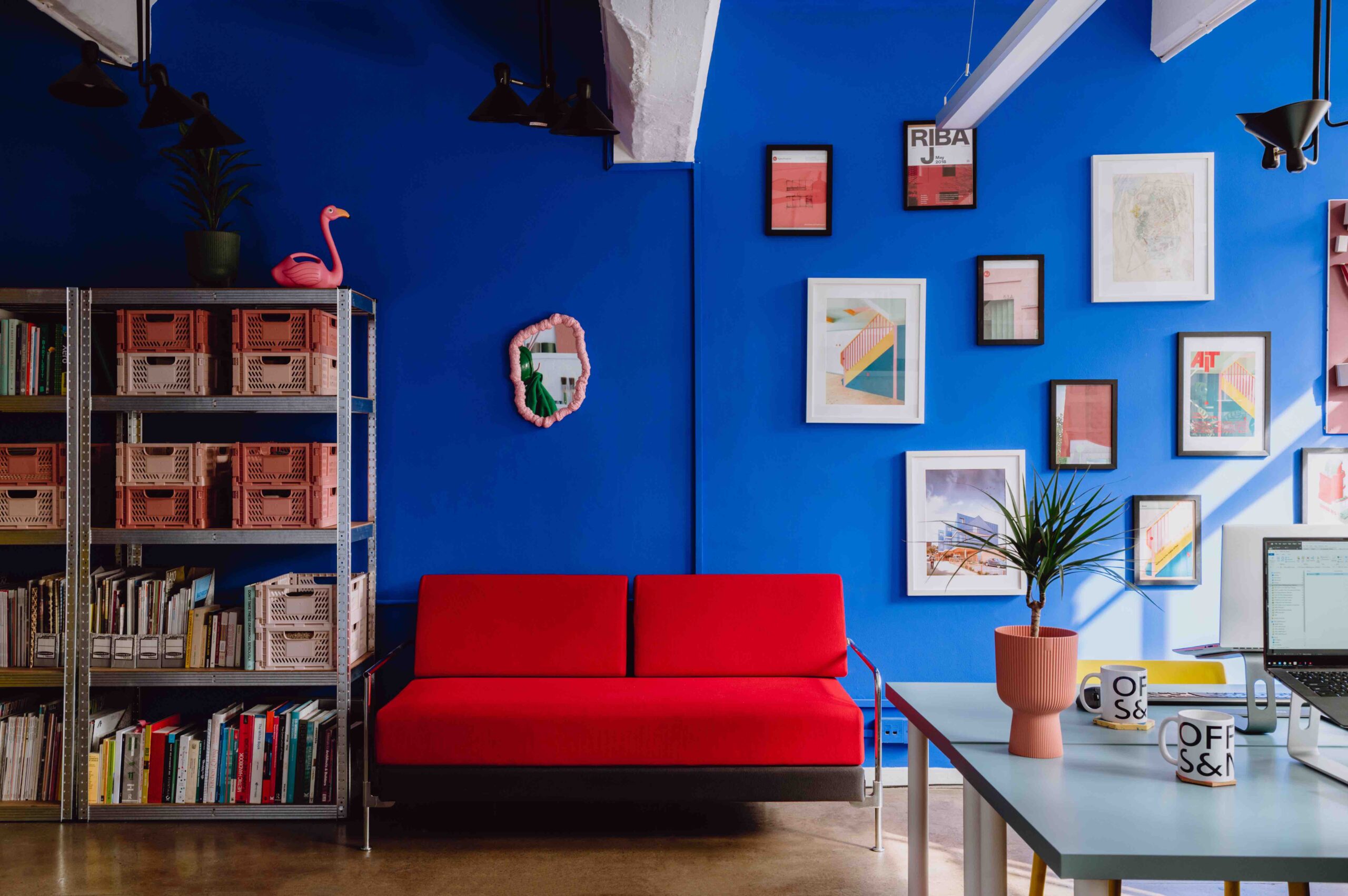 Red sofa against blue wall