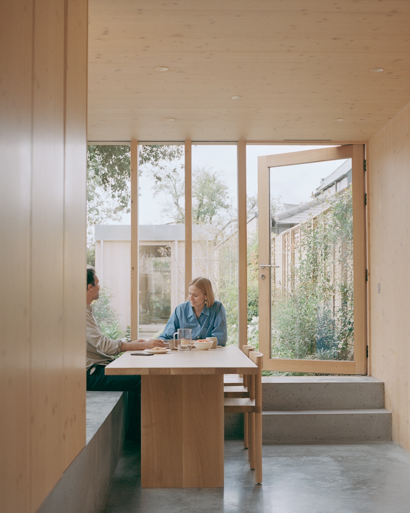 Spruce House interior people sitting at desk